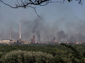 Smoke rises after a military strike on a compound of Sievierodonetsk's Azot Chemical Plant, amid Russia's attack on Ukraine, Lysychansk, Luhansk region, Ukraine June 10, 2022. Picture taken June 10, 2022.