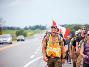 28-year Canadian army veteran, James Topp, was released from the military during the pandemic. After the Freedom Convoy in Ottawa, Topp decided to walk across Canada protesting federal government mandates. Topp, who has been walking across Canada since February, was just west of the city near Antrim, Sunday, June 26, 2022.