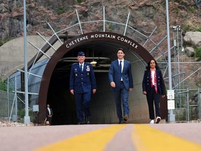 Prime Minister Justin Trudeau and National Defence Minister Anita Anand walk with Gen. Glen VanHerck, Commander of U.S. Northern Command and North American Aerospace Defense Command at the Cheyenne Mountain Space Force Station facility in Colorado Springs, Colo., on June 7, 2022.