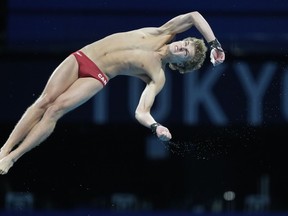 Rylan Wiens of Canada competes in men's diving 10m platform preliminary at the Tokyo Aquatics Centre at the 2020 Summer Olympics, Friday, Aug. 6, 2021, in Tokyo, Japan.