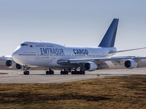 A Venezuelan-owned Boeing 747 taxis on the runway after landing in the Ambrosio Taravella airport in Cordoba, Argentina, Monday, June 6, 2022. Argentine officials are trying to determine what to do with the cargo plane loaded with automotive parts and an unusually large crew of 17, including at least five Iranians. The plane operated by Venezuela's state-owned Emtrasur cargo line has been stuck since June 6 at Buenos Aires' main international airport, unable to depart because of U.S. sanctions against Iran. and suspicions about its crew.