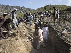 Afghans dig a trench for a common grave for their relatives killed in an earthquake to a buria site l in Gayan village, in Paktika province, Afghanistan, Thursday, June 23, 2022. Some Afghan-Canadians say they are worried Wednesday's magnitude 6 earthquake in eastern Afghanistan could heighten the country's already dire humanitarian crisis.