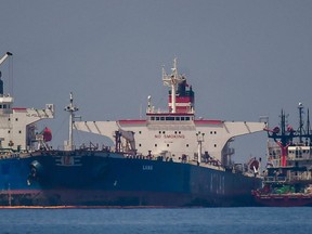 The Liberian-flagged oil tanker Ice Energy (L) transfers crude oil from the Iranian-flagged oil tanker Lana (R) (former Pegas), off the shore of Karystos, on the Island of Evia, on May 29, 2022. - Greece will send Iranian oil from a seized Russian-flagged tanker to the United States at the request of the US judiciary, Greek port police said Wednesday, a decision that angered Tehran. Last month the Greek authorities seized the Pegas, which was said to have been heading to the Marmara terminal in Turkey. The authorities seized the ship in accordance with EU sanctions introduced after Russia invaded Ukraine in February. (Photo by Angelos Tzortzinis / AFP) (Photo by ANGELOS TZORTZINIS/AFP via Getty Images)