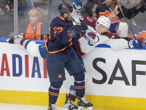 Colorado Avalanche Josh Manson (42) is hit by Edmonton Oilers Brad Malone (24) during second period NHL playoff hockey action in Edmonton, Monday, June 6, 2022. The&ampnbsp;Oilers have re-signed depth forward Brad Malone to a two-year, two-way contract.&ampnbsp;THE CANADIAN PRESS/Amber Bracken