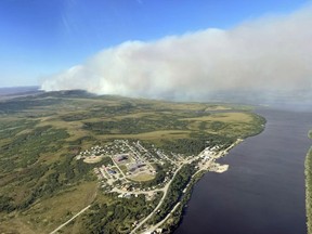 This June 10, 2022, aerial photo provided by the Bureau of Land Management Alaska Fire Service shows a tundra fire burning near the community of St. Mary's, Alaska. The largest documented wildfire burning through tundra in southwest Alaska was within miles St. Mary's and another nearby Alaska Native village, Pitkas Point, prompting officials Friday to urge residents to prepare for possible evacuation.