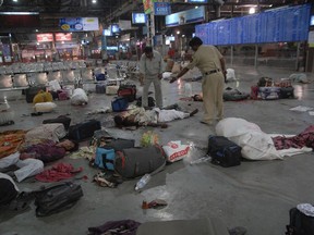 FILE - In this Nov. 26, 2008 file photo, injured commuters and dead bodies lie on the floor at the Chatrapathi Sivaji Terminal railway station in Mumbai, India. Pakistan sentenced Sajid Majeed Mir, 43, one of the militants linked to the 2008 terrorist attacks in Mumbai, India to 15 years in prison for terror financing unrelated to the assaults, according to court documents viewed by The Associated Press on Monday, Jun 27, 2022.