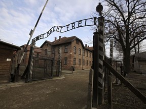 FILE - A view of the gate of the Auschwitz Nazi death camp in Oswiecim, Poland, Jan. 27, 2020. he Auschwitz-Birkenau museum says it has been targeted with the use of "primitive" propaganda after disinformation spread on Russian social media posts. The museum said Friday, June 24, 2022 that fake posts claim to show stickers placed around the memorial site in southern Poland, an area under German occupation during World War II. The stickers say "the only gas the Russians deserve is Zykon B."