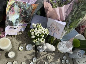 Floral tributes, candles and cards left at the scene on Cranbrook Road where Zara Aleena was murdered on in the early hours of Sunday, in Ilford, England, Wednesday June 29, 2022. Jordan McSweeney, 29, is charged with the murder of 35-year-old Zara Aleena, who was attacked as she was walking home from a night out in Ilford in the early hours of Sunday. In a statement, Aleena's family mourned her death and highlighted the killings of other women who were targeted by strangers in London and elsewhere.