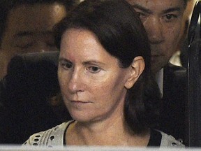 FILE - Julie Hamp, a former highest ranking woman executive of Toyota Motor Corp., leaves Harajuku police station after being released, in Tokyo Wednesday, July 8, 2015. Hamp, who resigned from Toyota after being arrested in Japan on suspicion of drug law violations in 2015, is back at the Japanese automaker's North America operations company helping oversee sustainability, governance and global media relations, Toyota Motor Corp. said Thursday, June 23, 2022.