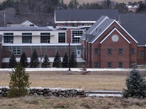 FILE -- The Sununu Youth Services Center, in Manchester, N.H., stands among trees, Jan. 28, 2020. A New Hampshire man who spent six years in state custody as a child is suing multiple facilities alleging physical and sexual abuse. The lawsuit filed Tuesday, June 14, 2022, is the latest of more than 400 targeting the Sununu Youth Services Center, formerly called the Youth Development Center, in Manchester. But in this case, the defendants also include the Nashua Children's Home, Mount Prospect Academy in Plymouth, and an Easter Seals facility called the Jolicoeur School in Manchester.