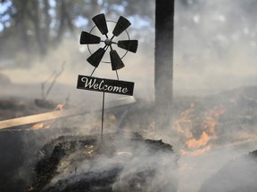 A welcome home sign sits at the front gate of a home along Troost Trail, that was saved by firefighters from the Rices Fire on Tuesday, June 28, 2022, in California's Nevada County.