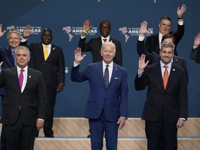 President Joe Biden, center participates in a family photo beside Colombian President Ivan Duque, left, and Paraguay President Mario Abdo Benitez and other heads of delegations at the Summit of the Americas, Friday, June 10, 2022, in Los Angeles.