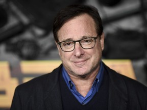 FILE - Bob Saget arrives at a screening of "MacGruber" on Dec. 8, 2021, in Los Angeles. Saget's family has released a statement on the cause of his death last month in Florida, citing authorities saying the actor-comedian died from an accidental blow to the head.