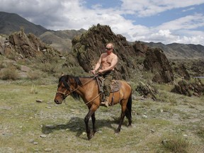 Then-Prime Minister of Russia Vladimir Putin ia seen riding a horse while traveling in the mountains of the Siberian Tyva region (also referred to as Tuva), Russia, during his short vacation. G7 leaders gathering in Germany to discuss increasing the pressure on Vladimir Putin over the war in Ukraine are also taking aim at the Russian president's penchant for taking off his shirt.