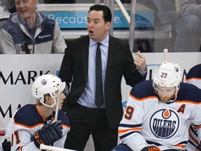 Edmonton Oilers head coach Jay Woodcroft gives instructions during the first period of the team's NHL hockey game against the Pittsburgh Penguins in Pittsburgh, Tuesday, April 26, 2022.