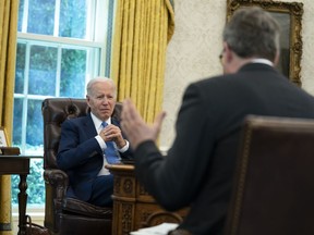 President Joe Biden listens to a question during an interview with the Associated Press in the Oval Office of the White House, Thursday, June 16, 2022, in Washington.