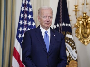 President Joe Biden listens as Vincent Duvall, President of the American Farm Bureau Federation, introduces him to speak in the State Dining Room of the White House, Thursday, June 16, 2022, in Washington.
