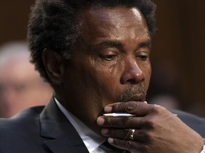 Garnell Whitfield, Jr., of Buffalo, N.Y., whose mother, Ruth Whitfield, was killed in the Buffalo Tops supermarket mass shooting, wipes away tears as he testifies at a Senate Judiciary Committee hearing on domestic terrorism, Tuesday, June 7, 2022, on Capitol Hill in Washington.