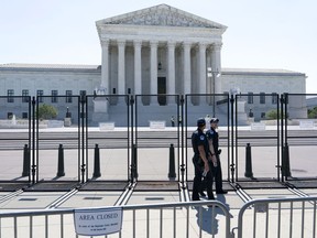 Security works outside of the Supreme Court, Thursday, June 30, 2022, in Washington.