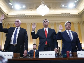 Rusty Bowers, Arizona state House Speaker, from left, Brad Raffensperger, Georgia Secretary of State, and Gabe Sterling, Georgia Deputy Secretary of State, are sworn in to testify as the House select committee investigating the Jan. 6 attack on the U.S. Capitol continues to reveal its findings of a year-long investigation, at the Capitol in Washington, Tuesday, June 21, 2022.
