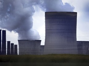 Steam rises out of the cooling towers of the Niederaussem lignite-fired power plant in Pulheim, Germany, Monday, June 20, 2022. The German government said that it remains committed to its goal of phasing out coal as a power source by 2030 despite deepening worries about a cut in Russia's gas supplies.