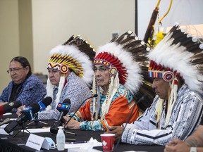 From left, Chief Desmond Bull, Chief Randy Ermineskin, Chief Wilton Littlechild and Chief Vernon Saddleback, speak about the announcement from the Vatican of the Papal visit, in Maskwacis Alta, on Monday, June 27, 2022. Leaders from four First Nations in central Alberta say the Pope's upcoming visit could help the world understand the impacts and intergenerational trauma that the residential school system inflicted on Indigenous people.