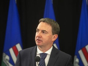 Alberta Health Minister Jason Copping gives an update in Edmonton on Tuesday, Sept. 21, 2021. The Alberta government has approved a bid by the Enoch Cree Nation near Edmonton to build a private clinic to perform thousands of publicly covered hip and knee surgeries. Copping says the clinic is to be build by the middle of next year to reduce a backlog of orthopedic operations in and around the capital city.