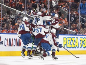 Colorado Avalanche celebrate the win over the Edmonton Oilers during overtime NHL conference finals action in Edmonton on Monday, June 6, 2022.THE CANADIAN PRESS/Jason Franson