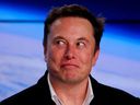 FILE PHOTO: SpaceX founder Elon Musk reacts at a post-launch news conference after the SpaceX Falcon 9 rocket, carrying the Crew Dragon spacecraft, lifted off on an uncrewed test flight to the International Space Station from the Kennedy Space Center in Cape Canaveral, Florida, U.S., March 2, 2019. REUTERS/Mike Blake/File Photo