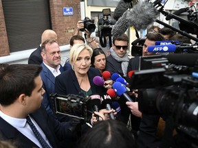 French far-right leader Marine Le Pen adresses reporters Monday, June 20, 2022 in Henin-Beaumont, northern France. French President Emmanuel Macron's centrist alliance was projected to lose its majority despite getting the most seats in the final round of parliamentary elections Sunday, while the far-right National Rally appeared to have made big gains. (AP Photo)