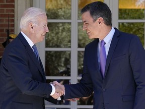 President Joe Biden and Spain's Prime Minister Pedro Sánchez shake hands as they meet at the Palace of Moncloa in Madrid, Tuesday, June 28, 2022, to discuss continuing efforts to support Ukraine. Biden will also be attending the North Atlantic Treaty Organization summit in Madrid.