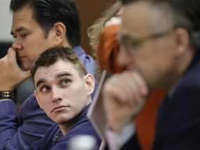 Marjory Stoneman Douglas High School shooter Nikolas Cruz sits at the defense table during jury selection in the penalty phase of his trial at the Broward County Courthouse in Fort Lauderdale, Fla., on Wednesday, June 29, 2022. A jury of seven men and five women have been sworn in for the penalty trial of Cruz. The final selections were made Wednesday with the defense using its final strikes to eliminate a banking executive and retired insurance executive who had tentatively been accepted Tuesday.