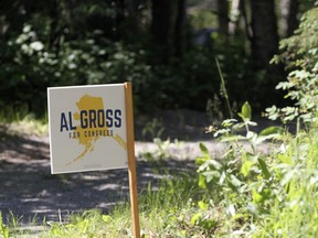 An "Al Gross for Congress" sign sits near the driveway to Gross' home in Anchorage, Alaska, on Tuesday, June 21, 2022, after he announced plans to withdraw from the U.S. House race. Gross has given little explanation in two statements for why he is ending his campaign, and a woman who answered the door at the Gross home asked a reporter to leave the property.