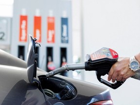 A motorist refuels his vehicle at a gas station, June 1, 2022.