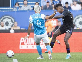 CF Montreal forward Romell Quioto (30) shoots and scores during first half MLS soccer action against as defender Guzmán Corujo looks on in Montreal, Saturday, June 25, 2022.
