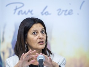 Coroner Gehane Kamel speaks during a news conference in Montreal, on May 19, 2022. A neuropsychiatrist who consulted a Quebec teen just months before he was killed by police in July 2018 told a coroner's inquiry Thursday he'd diagnosed him as suffering from symptoms related to traumatic brain injury in the months leading up to his death.