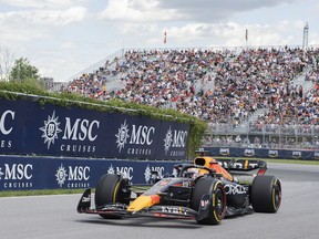 Red Bull driver Max Verstappen, of the Netherlands, takes a turn at the Senna corner during the first practice session at the Formula One Canadian Grand Prix in Montreal, Friday, June 17, 2022.