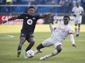 CF Montreal's Romell Quito, left, challenges Toronto FC's Noble Okello during second half Canadian Championship soccer action in Montreal, Sunday, Nov. 21, 2021. The Toronto and Montreal MLS soccer squads will play Wednesday night in Toronto in the Canadian Championship semifinals, with the winner earning a berth in Voyageurs Cup final.