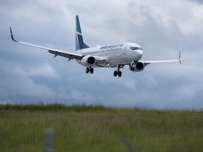 A WestJet flight from Calgary arrives at Halifax Stanfield International Airport in Enfield, N.S. on Monday, July 6, 2020. Industry watchers expect WestJet to remove routes from the Toronto-Montreal-Ottawa triangle as part of the Calgary-based airline's new strategy to focus future growth on Western Canada.