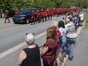 RCMP members escort the hearse at a regimental memorial service for Const. Heidi Stevenson in Dartmouth on Wednesday, June 29, 2022. Stevenson was killed, in the line of duty, along with 21 others during the April 2020 mass murders in rural Nova Scotia.