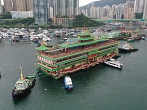 The Jumbo Floating Restaurant being towed out of Aberdeen Harbor on June 14.  Photographer: Peter Parks/AFP/Getty Images