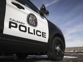 Police vehicles are shown at Calgary Police Service headquarters in Calgary, on April 9, 2020. Calgary police say they are investigating after an 83-year-old women died in an apparent dog attack in the city's northwest. CANADIAN PRESS/Jeff McIntosh
