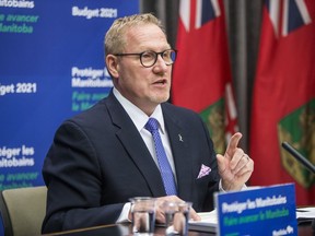 Manitoba finance minister Scott Fielding speaks to the media about the 2021 budget at the Manitoba Legislative Building in Winnipeg on Wednesday, April 7, 2021.