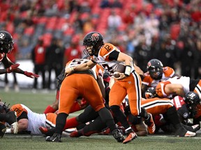 BC Lions quarterback Nathan Rourke (12) runs the ball on the way to a touchdown against the Ottawa Redblacks during first half CFL football action in Ottawa on Thursday, June 30, 2022.