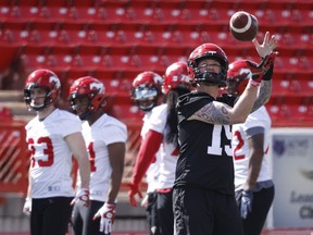 Calgary Stampeders quarterback Bo Levi Mitchell catches a ball during opening day of the CFL team's training camp in Calgary, Sunday, May 15, 2022.THE CANADIAN PRESS/Jeff McIntosh