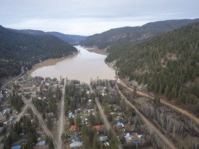 A swollen Otter Lake is pictured in Tulameen, B.C., Friday, Dec. 3, 2021. Officials in British Columbia are urging residents of communities at elevated risk of flooding to be prepared if water levels rise due to rapidly melting snow following too much rain.