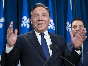Quebec Premier Francois Legault responds to reporters questions after Bill 96, a legislation modifying Quebec's language law, was voted, Tuesday, May 24, 2022 at the legislature in Quebec City.