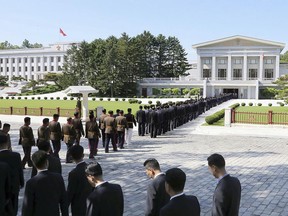 In this photo provided by the North Korean government, participants arrive at the headquarters of the ruling Workers' Party's Central Committee in Pyongyang, North Korea Wednesday, June 8, 2022. Independent journalists were not given access to cover the event depicted in this image distributed by the North Korean government. The content of this image is as provided and cannot be independently verified. Korean language watermark on image as provided by source reads: "KCNA" which is the abbreviation for Korean Central News Agency. (Korean Central News Agency/Korea News Service via AP)