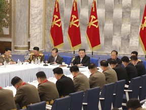 In this photo provided by the North Korean government, North Korean leader Kim Jong Un, rear center, attends a meeting of the Central Military Commission of the ruling Workers' Party, which were held between June 21 and 23, 2022, in Pyongyang, North Korea. Independent journalists were not given access to cover the event depicted in this image distributed by the North Korean government. The content of this image is as provided and cannot be independently verified.