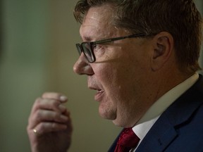 Scott Moe speaks to media in the chamber of the legislator in Regina, Wednesday, March 23, 2022. The Saskatchewan premier has signed off on dozens of pardons for people with traffic offences, including his own brother.THE CANADIAN PRESS/Liam Richards